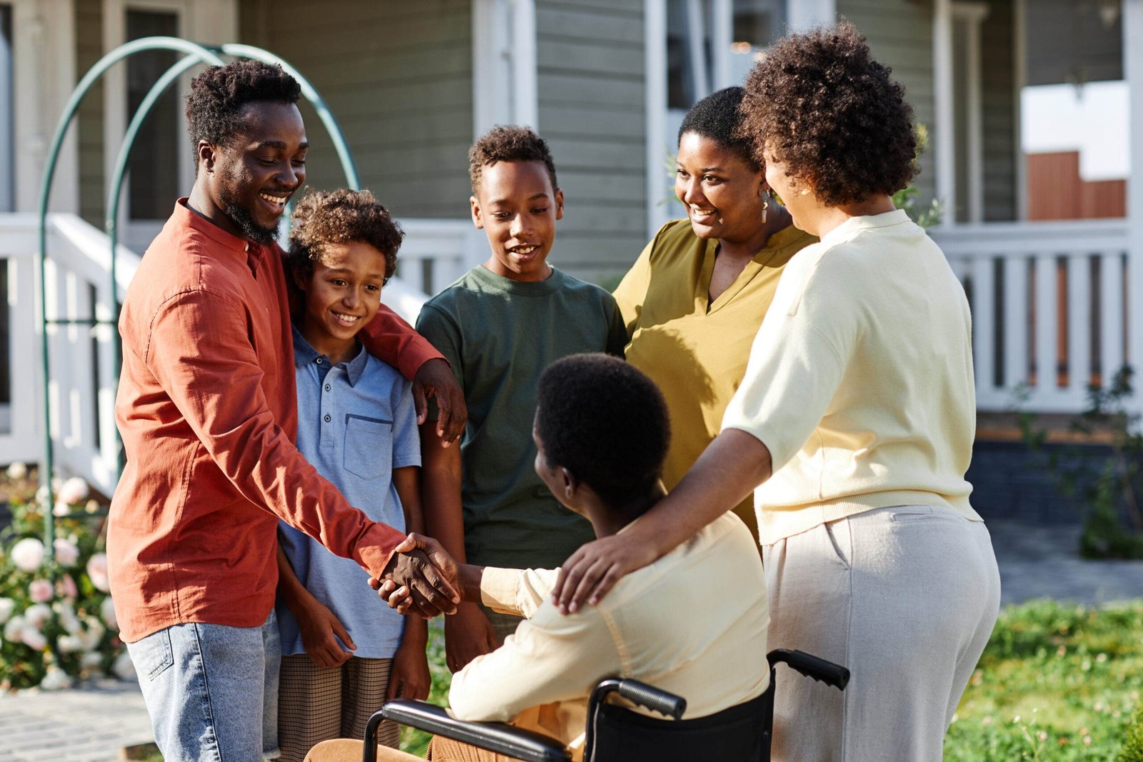 portrait big african american family with person wheelchair chatting outdoors gathering scaled